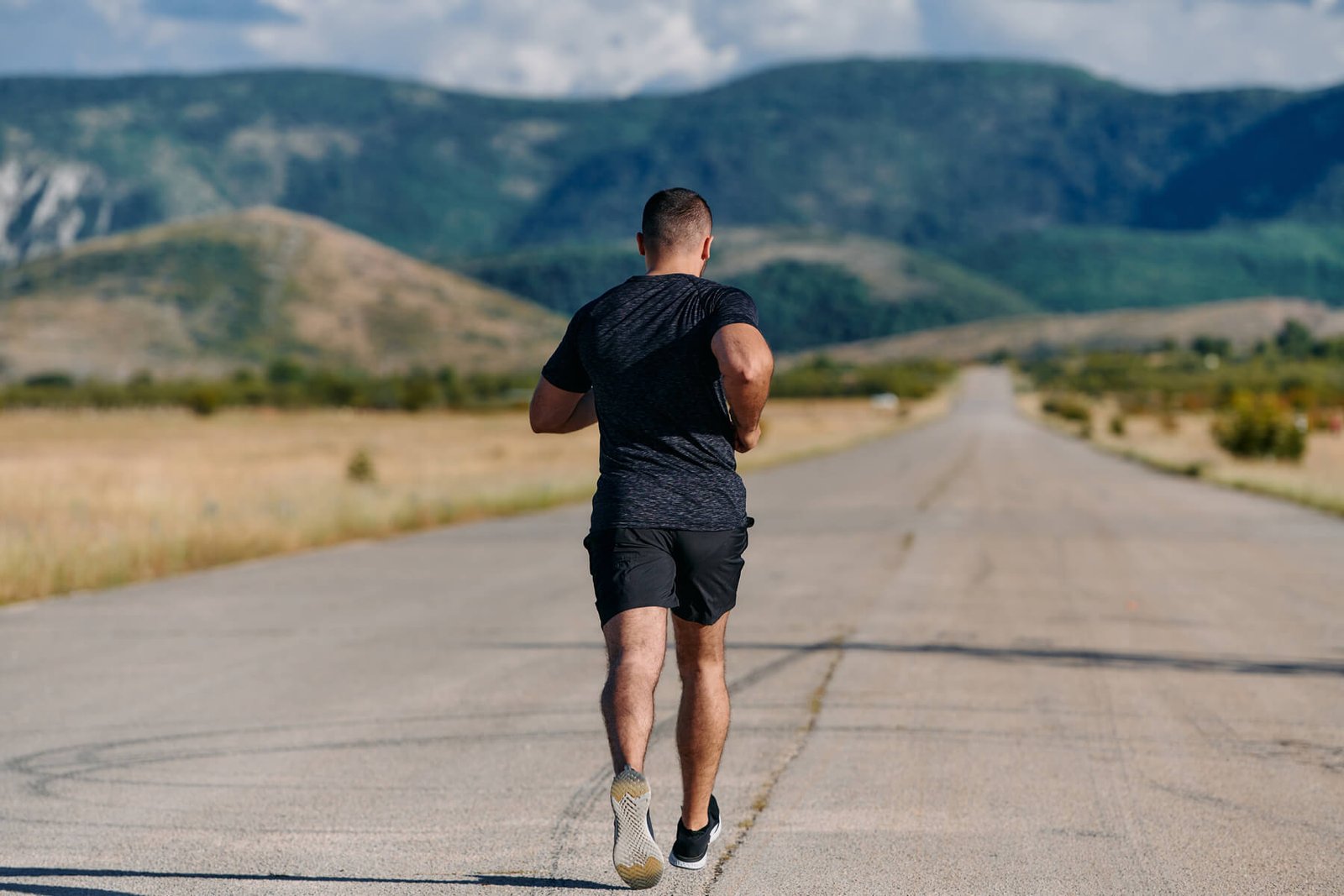 athletic man jogging in the sun preparing his bod 2024 06 12 02 21 41 utc