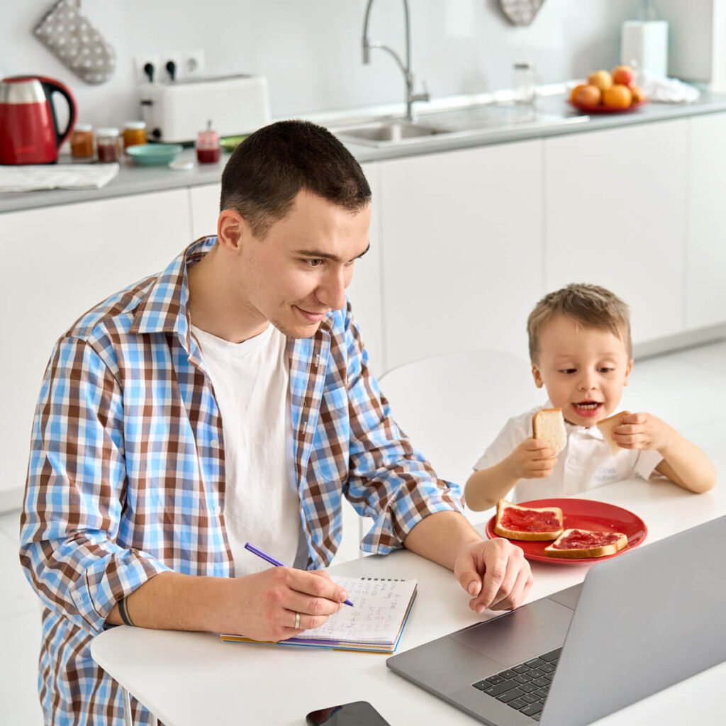 father working from home office using laptop sitti 2023 11 27 05 00 35 utc
